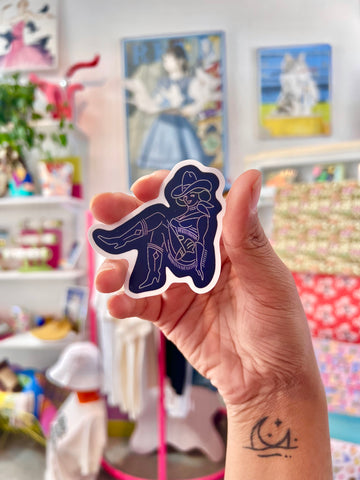 A Vegas Vickie sticker showcasing the iconic neon sign from Fremont Street. The sticker features vibrant colors and intricate details, perfect for decorating laptops, water bottles, and more. Bring a touch of vintage Las Vegas charm wherever you go with this durable and waterproof sticker.